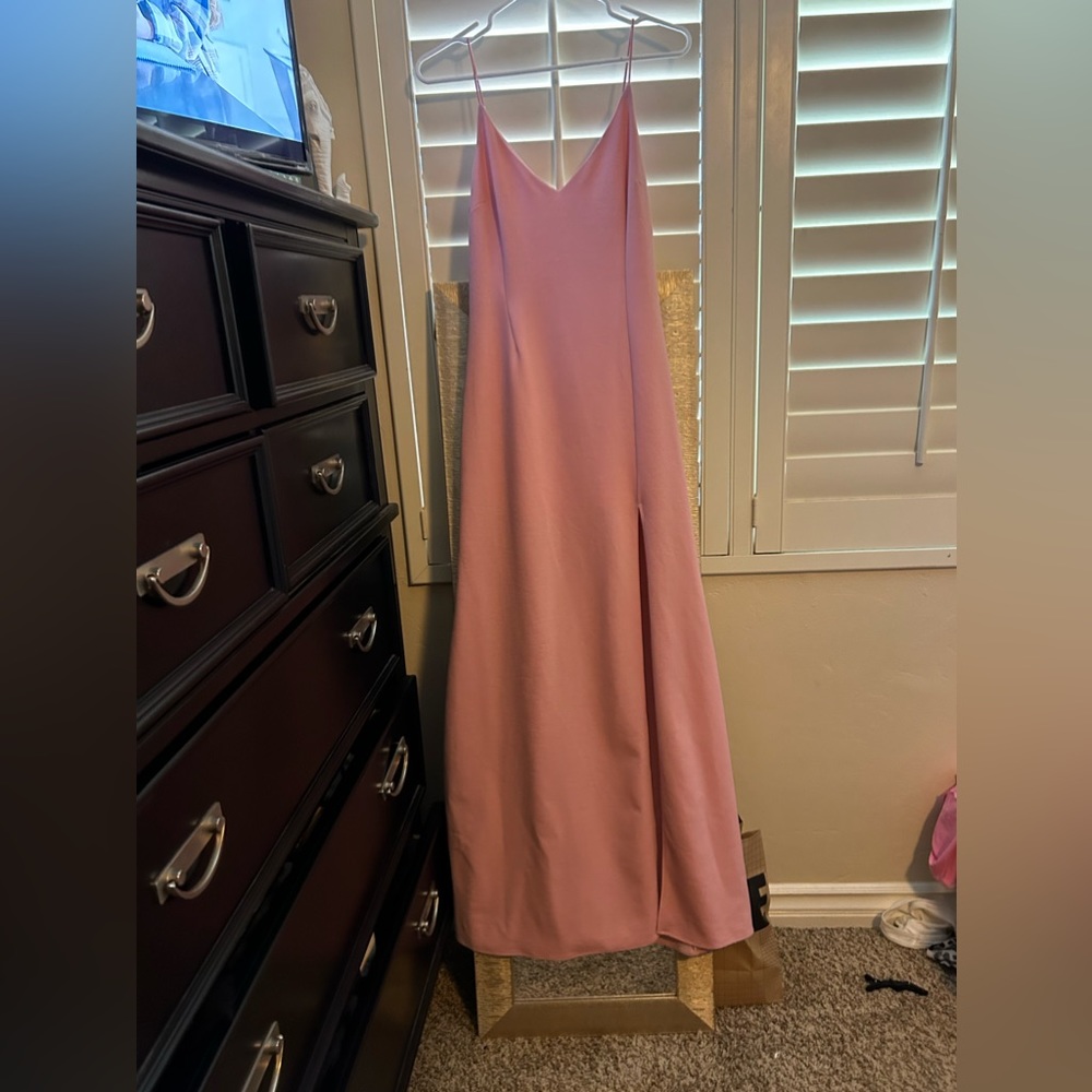 light pink floor length dress with a slit it was bought at saks and worn once